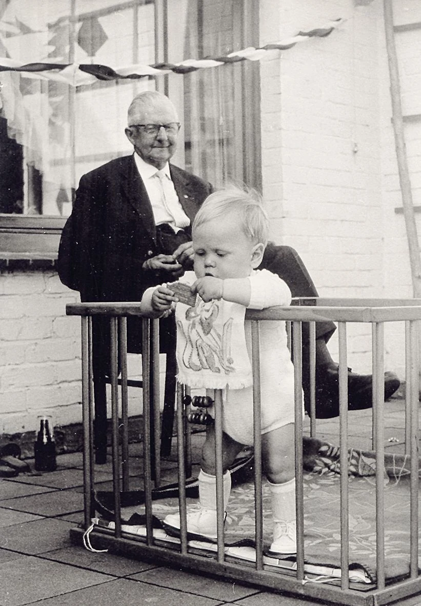 Willy Groth looking affectionately at his young grandson Wolf in 1963